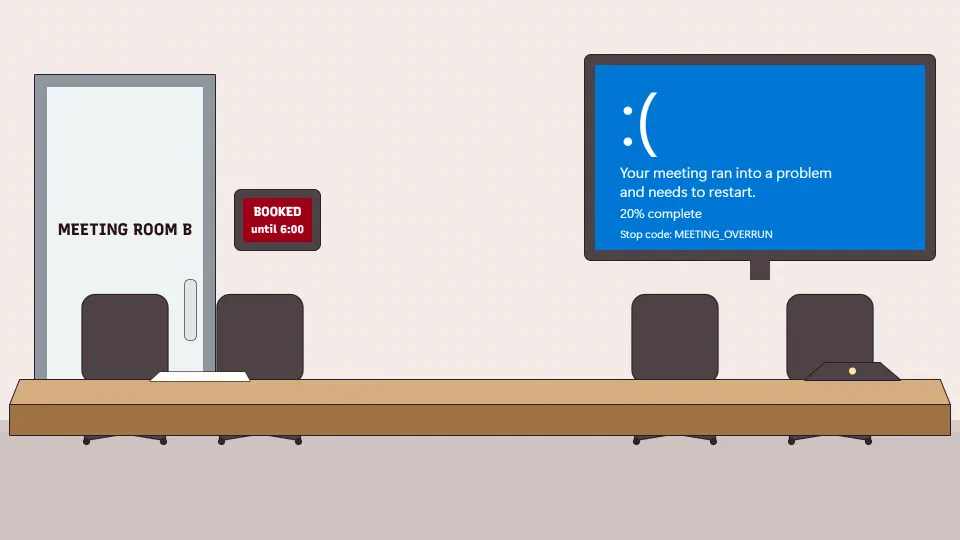 A meeting room with a long table and empty chairs. The screen on the wall shows a blue crash screen with a sad face and the stop code MEETING_OVERRUN.
